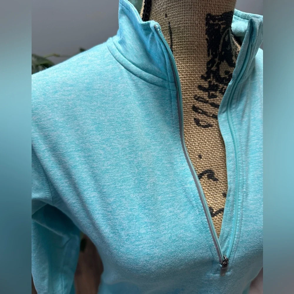 Nike Element dri fit light teal 1/2 zip up running top with thumb holes. Size S.